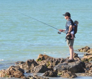 A father babysitting while fishing
