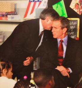 Andrew Card advising President Bush of the initial attacks on the World Trade Center