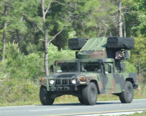 Part of an Army convoy or Jeeps with missile launchers