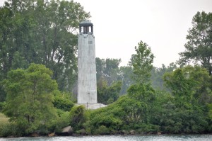  The fluted tower of white Georgia marble sits on an octagonal base and stands 58 feet tall. A bronze lantern room topping the tower brings the lighthouse's total height to about 80 feet and houses an 11,500 candlepower light visible up to 15 miles away on Lake St. Clair.