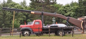 Big Ernie, 33’ 4” long, once fired a makeshift bullet (a duct-tape wrapped rock) into a corn field, 2.5 miles away! The recoil, as the story goes, knocked the Big Rifle off of the truck it’s mounted on. Meanwhile, the shockwave broke windows at the nearest farmhouse!