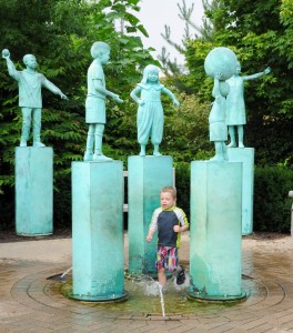 Young Boy among Children of the World water feature